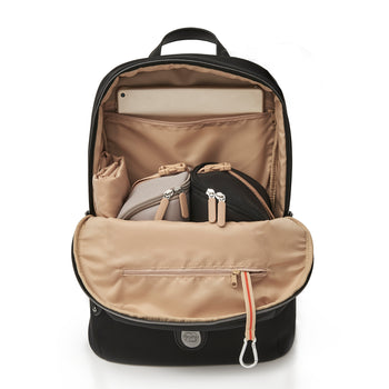 lady with baby lying down cuddling in front of the baby changing bag