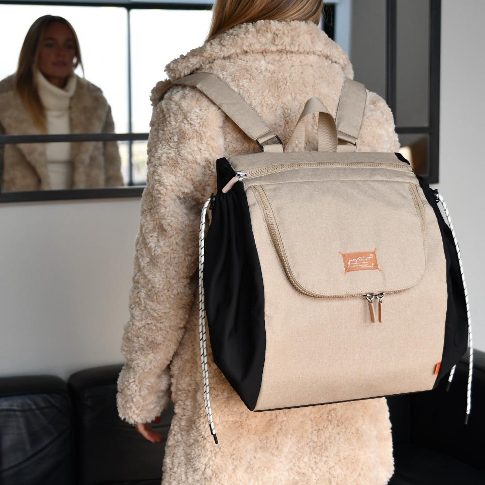 sesame jacapod backpack on fur coat