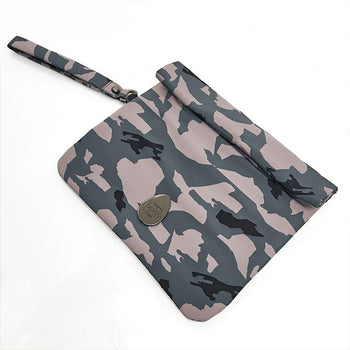 Woman stood on some rocks with the pacadry camo hanging from her wrist by her side