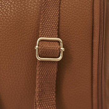 lady wearing freedom pod on her back, carry as a backpack in tan