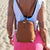 lady wearing freedom pod on her back, carry as a backpack in tan