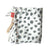 Dalmation print baby muslin swaddle cloth rolled up on a white background next to real bamboo shoots