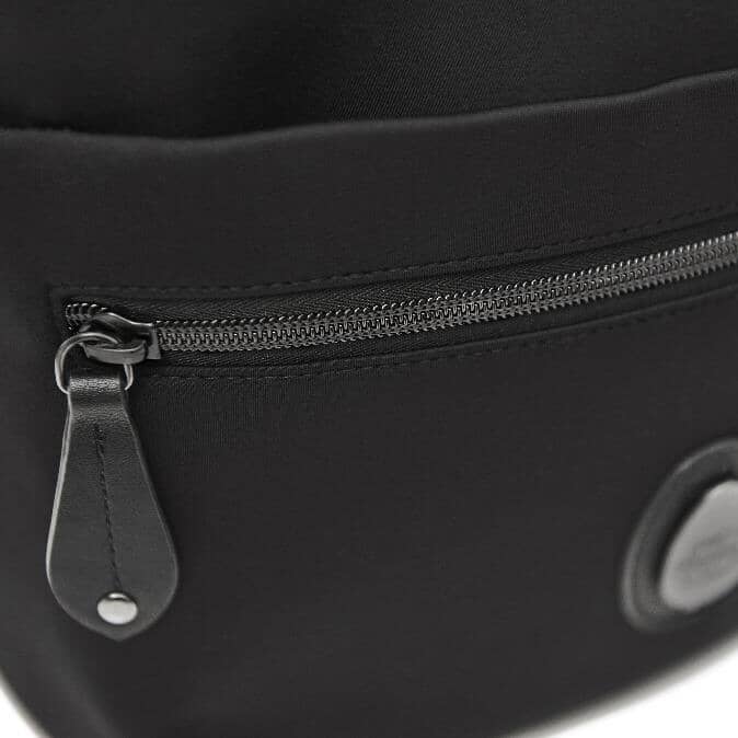 Close up of the zip on the front pocket of the Rockham black backpack