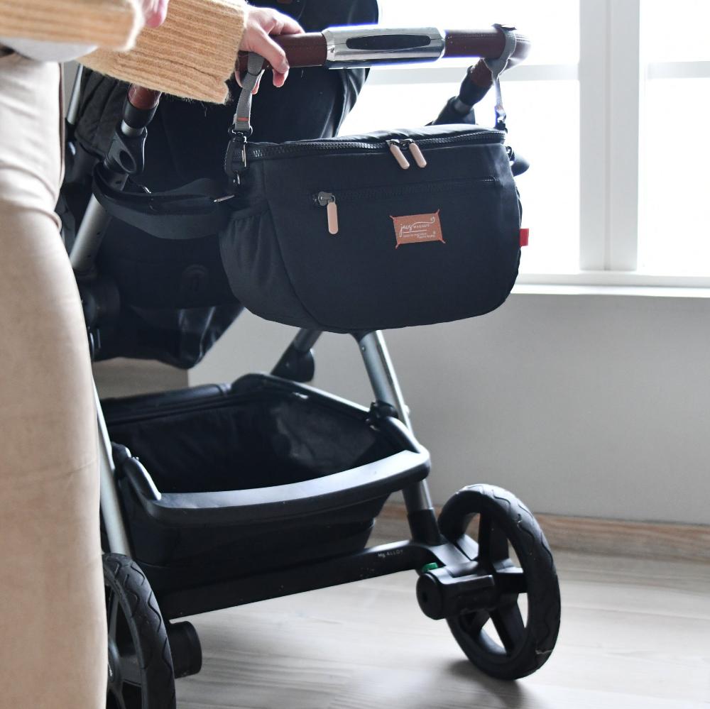 pacasling on pram with mums hand