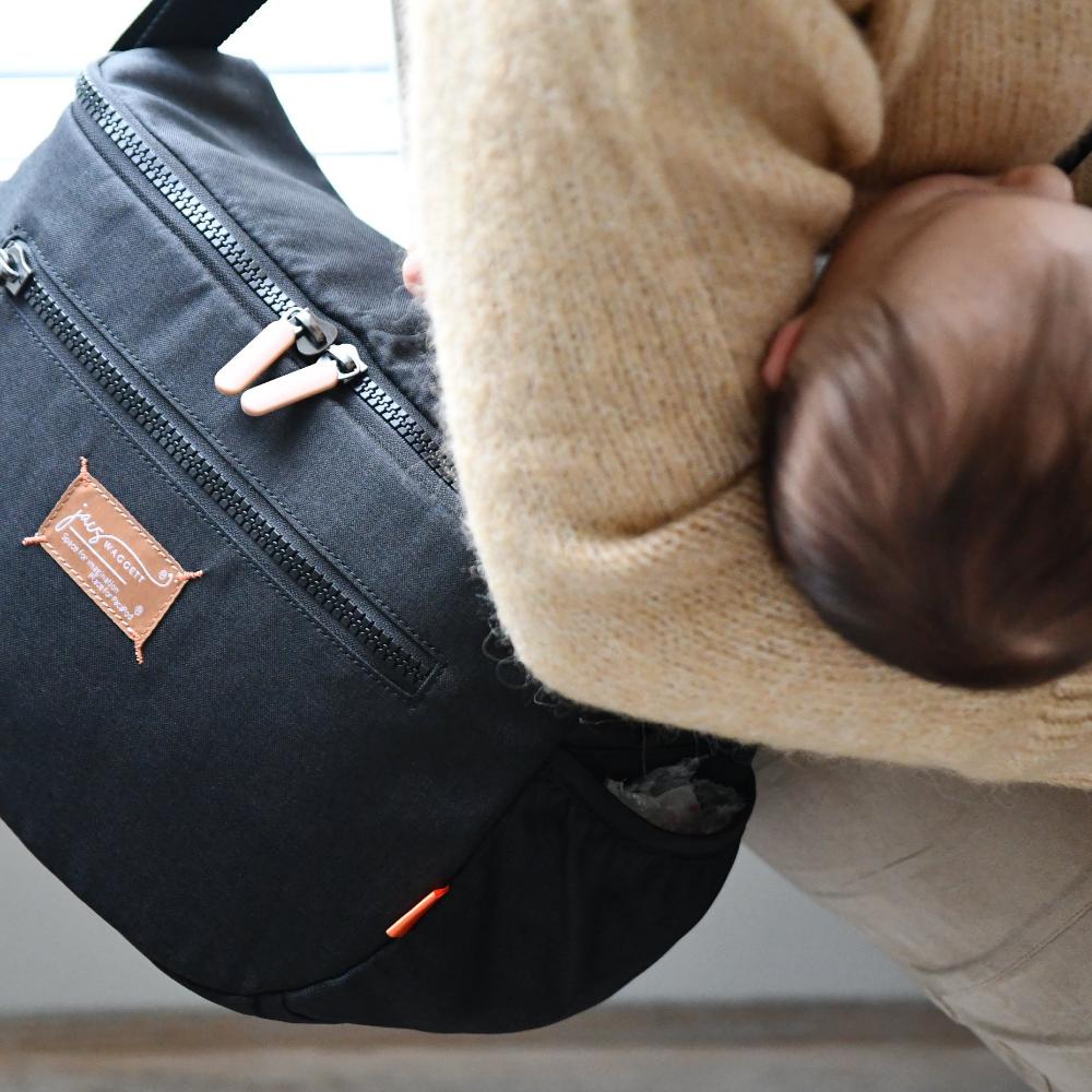 sling bag with baby in arms