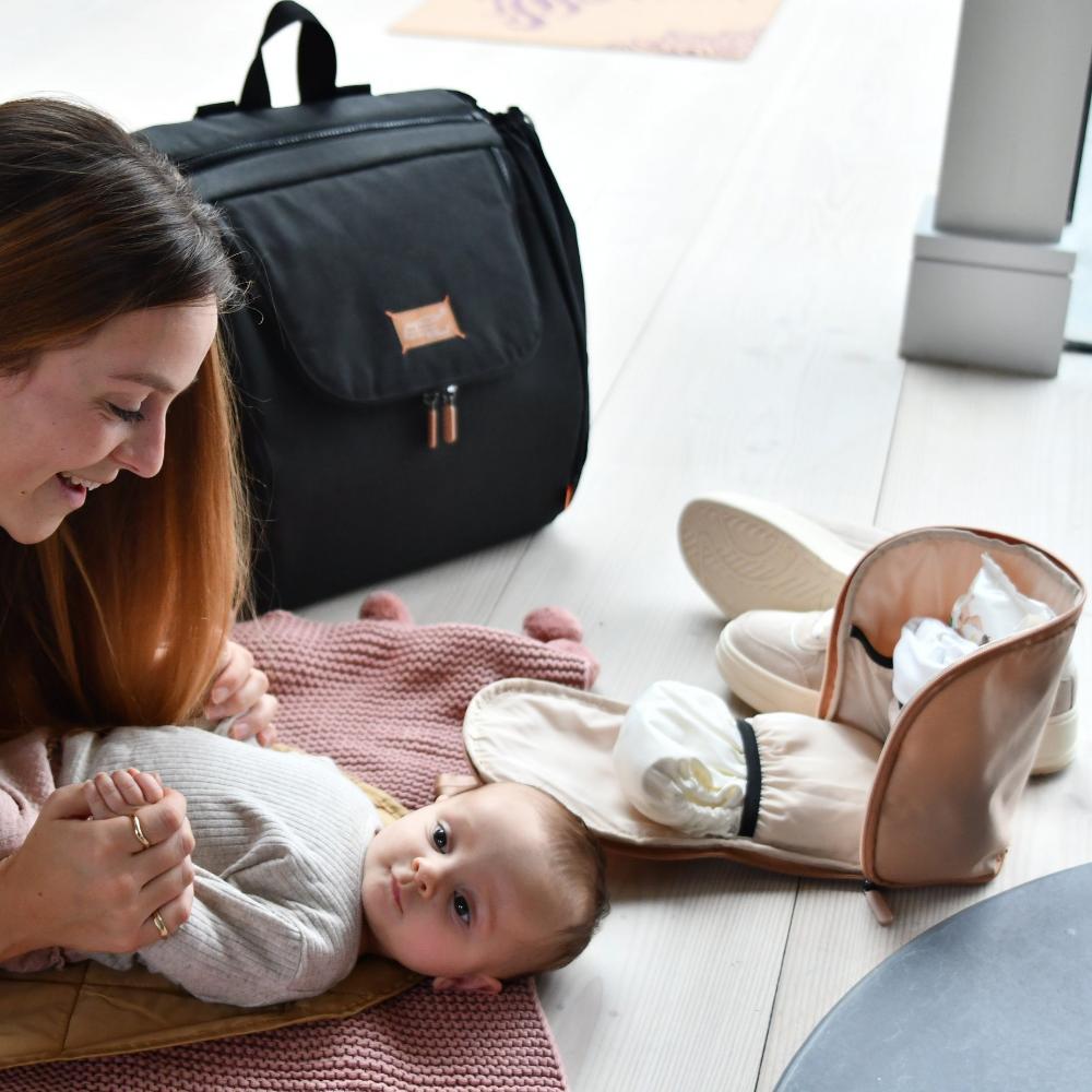 organise pod blush with baby on mat