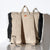 sesame jacapod backpack on fur coat
