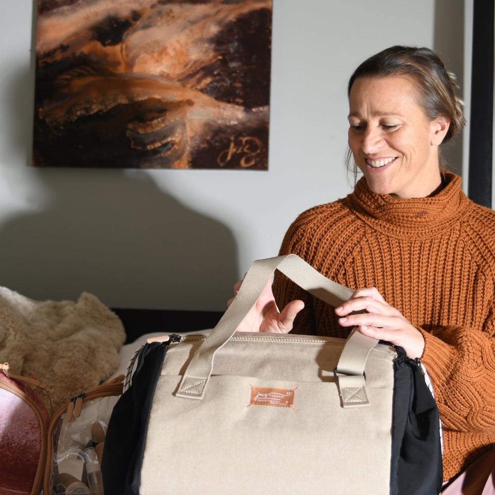 sesame jacatote on bed with model