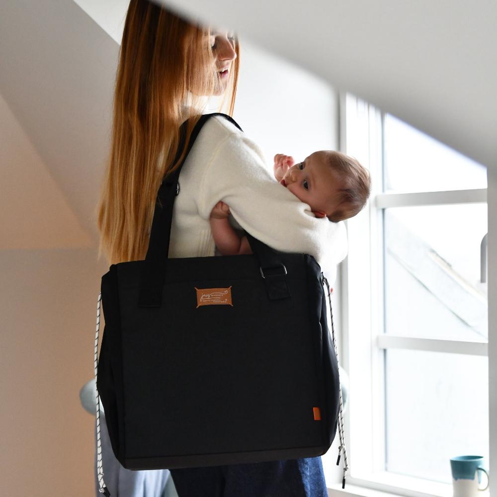 jacatote on shoulder with baby