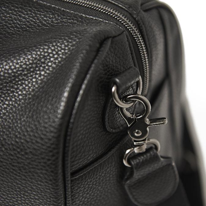 Close up image of the metal trim on the shoulder strap clip and D-ring