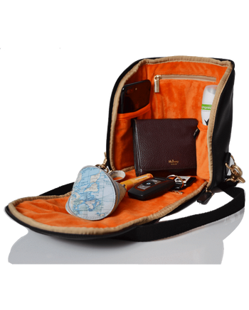 Woman wearing the freedom pod black on her back while outdoors