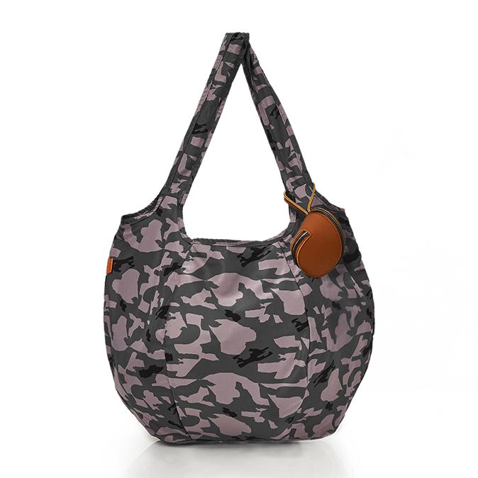 Filled pacsac with handles up and the tan case showing