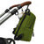Rockham in pea green with the changer pod and feeder pod to the side and the changer mat and pram clips laid out in front