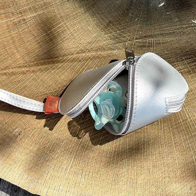 Partially open minipod with a soother inside